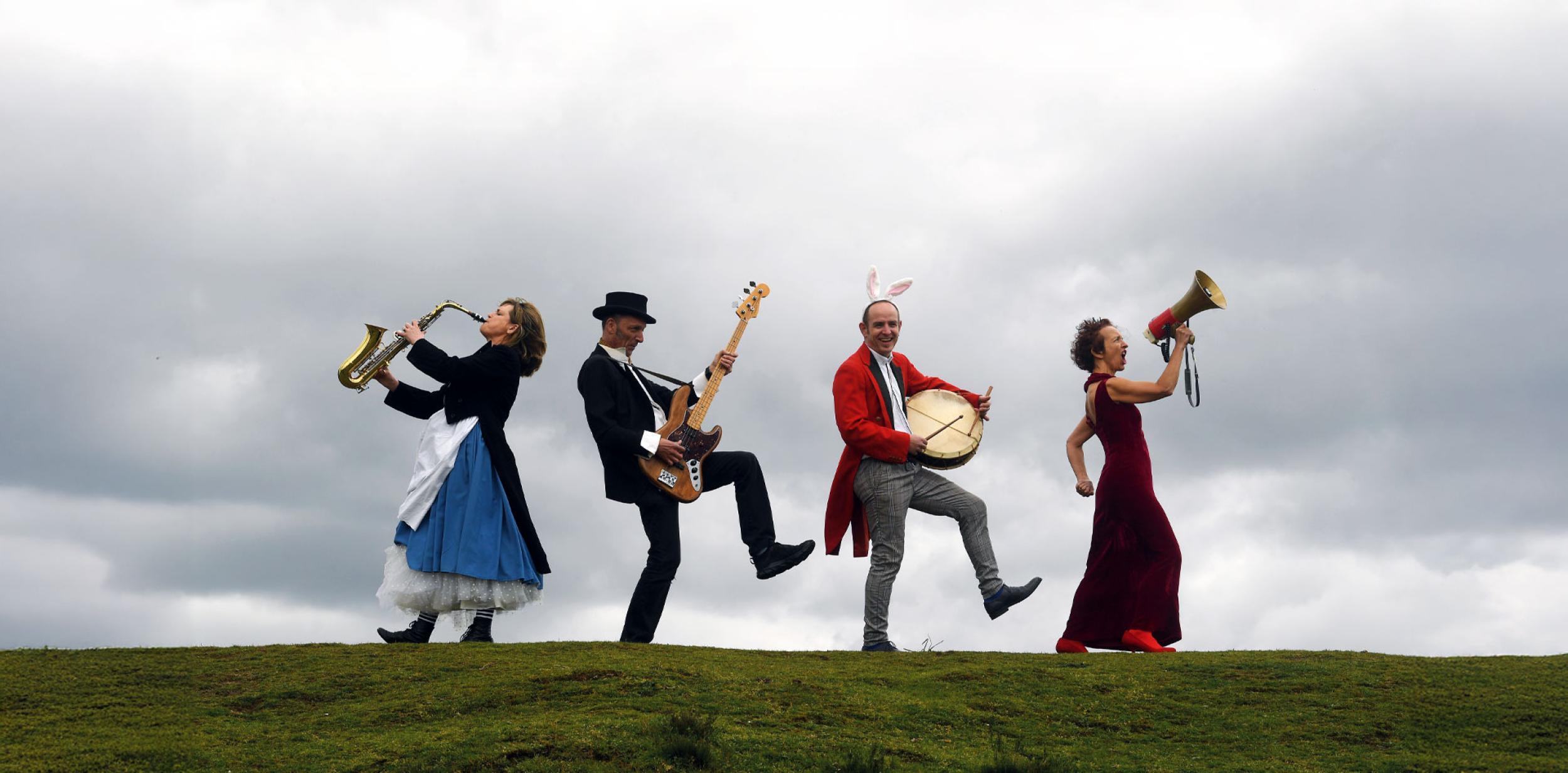 Musicians on a grassy hill