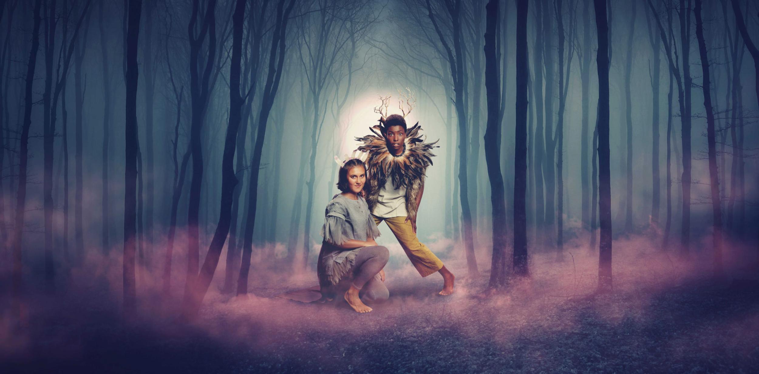 Two people in the middle of a mystical woodland