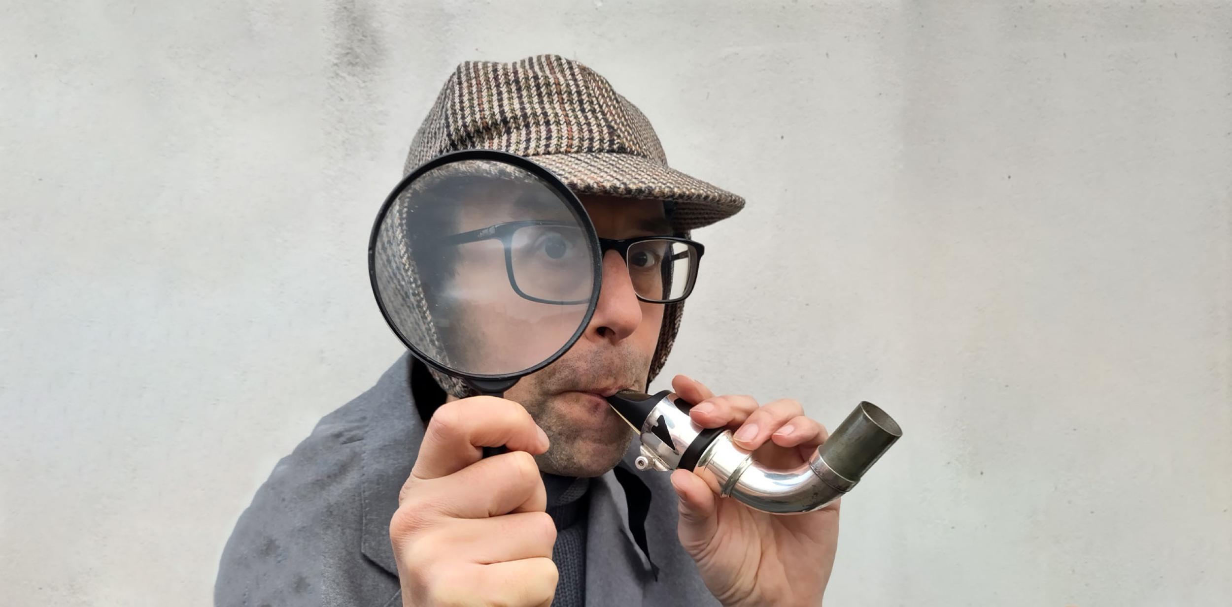 Person holding a magnifying glass