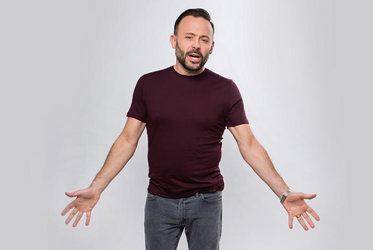 Geoff Norcott with his arms reaching out