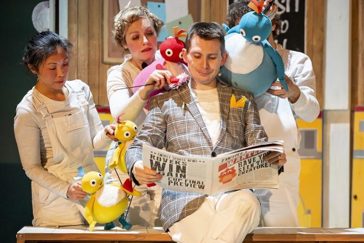 Twirlywoo puppets reading the paper with an actor