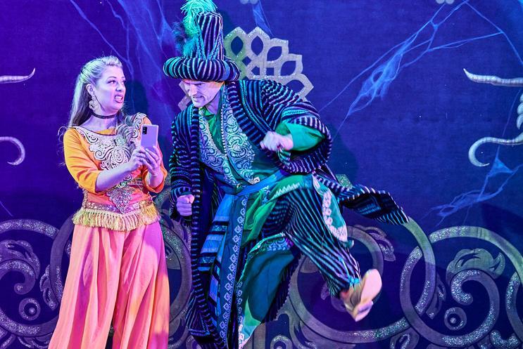 Panto characters looking at a phone